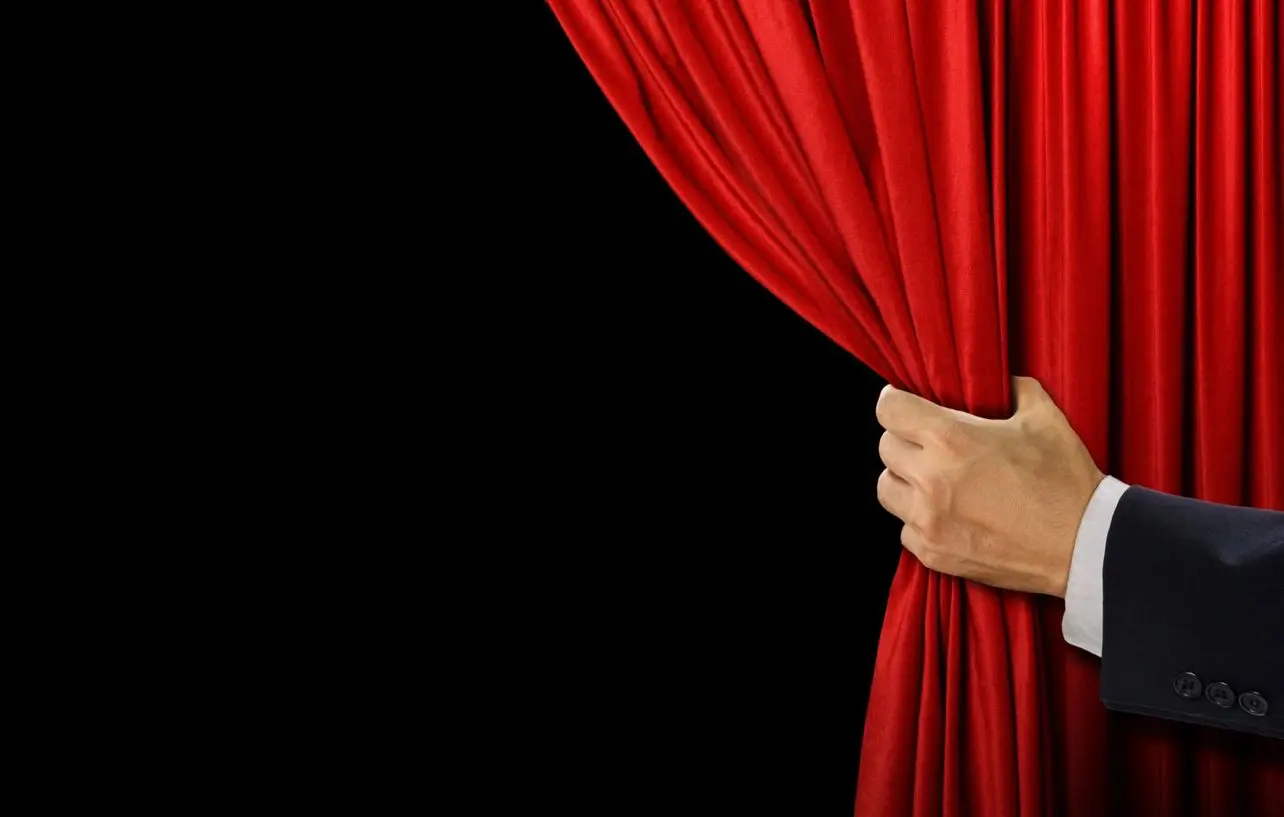 Hand open stage red curtain on black background Hand open stage red curtain on black background